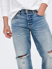 Jeans scaoilte imeall - denim gorm éadrom